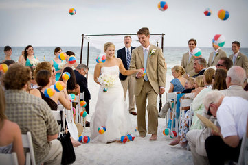 send off the bride and groom with mini beach balls at a beach themed wedding #PreppyPlanner